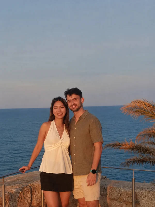 Couple together by the sea at sunset