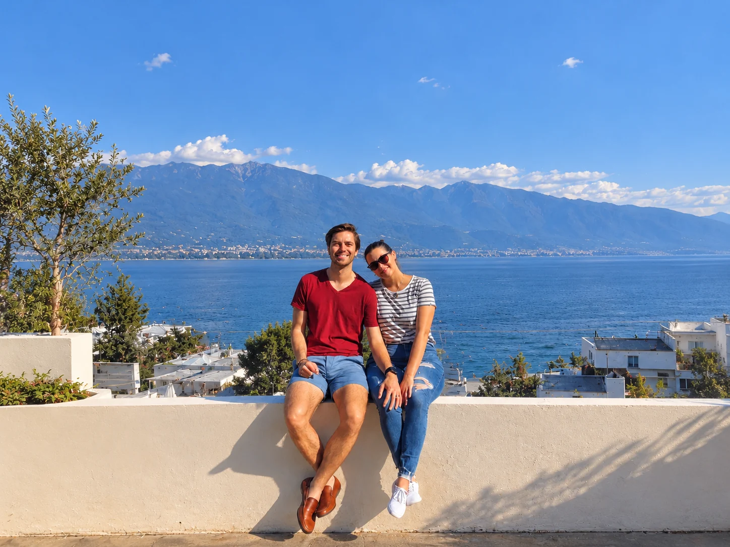 Couple together beside a mountain lake